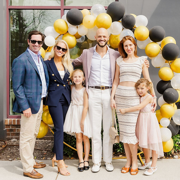 Dental team member showing a clipboard to a patient