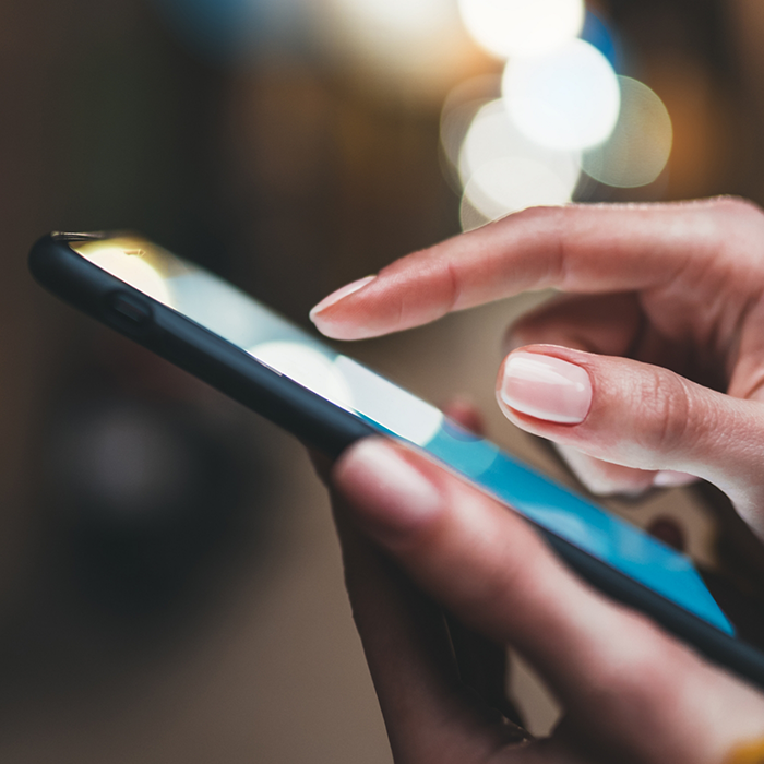 Close up of a person scrolling on their phone