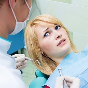 Woman afraid at the dentist