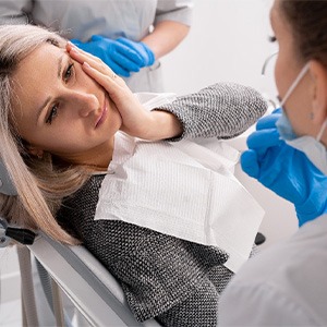 Woman in pain at the dentist